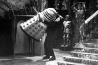 [A robot of Frankenstein's creature attacks a Dalek.]